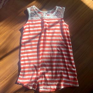 Reddish orange and white striped top